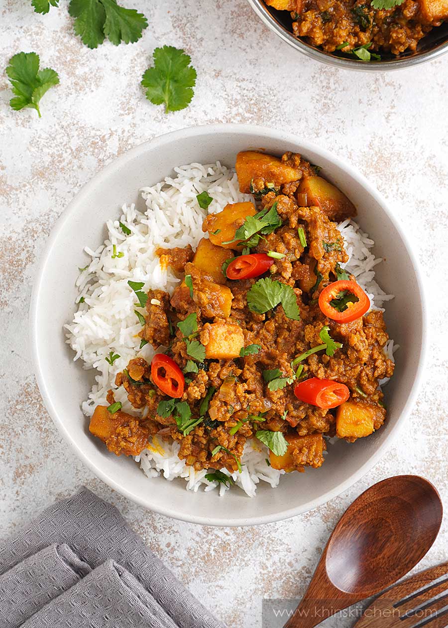 Ground beef, potato cubes, chilli slices, and coriander with brown curry sauce served over the white basmati rice