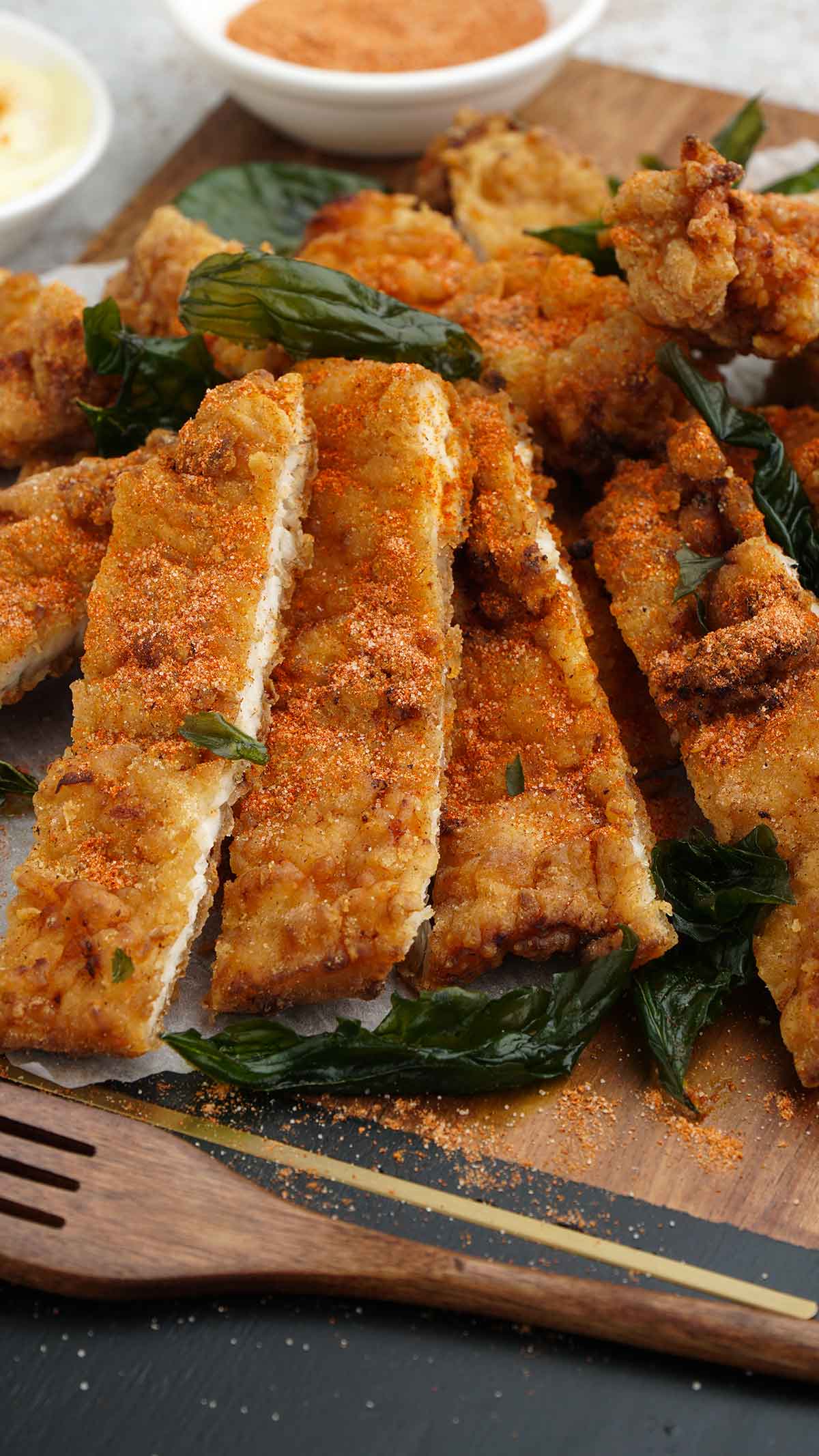 fried chicken topped with asian spices and crispy basil.