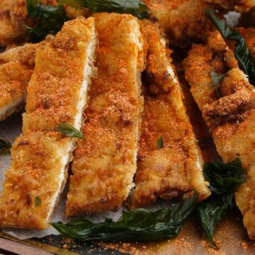 taiwanese fried chicken and crispy basil on the serving board