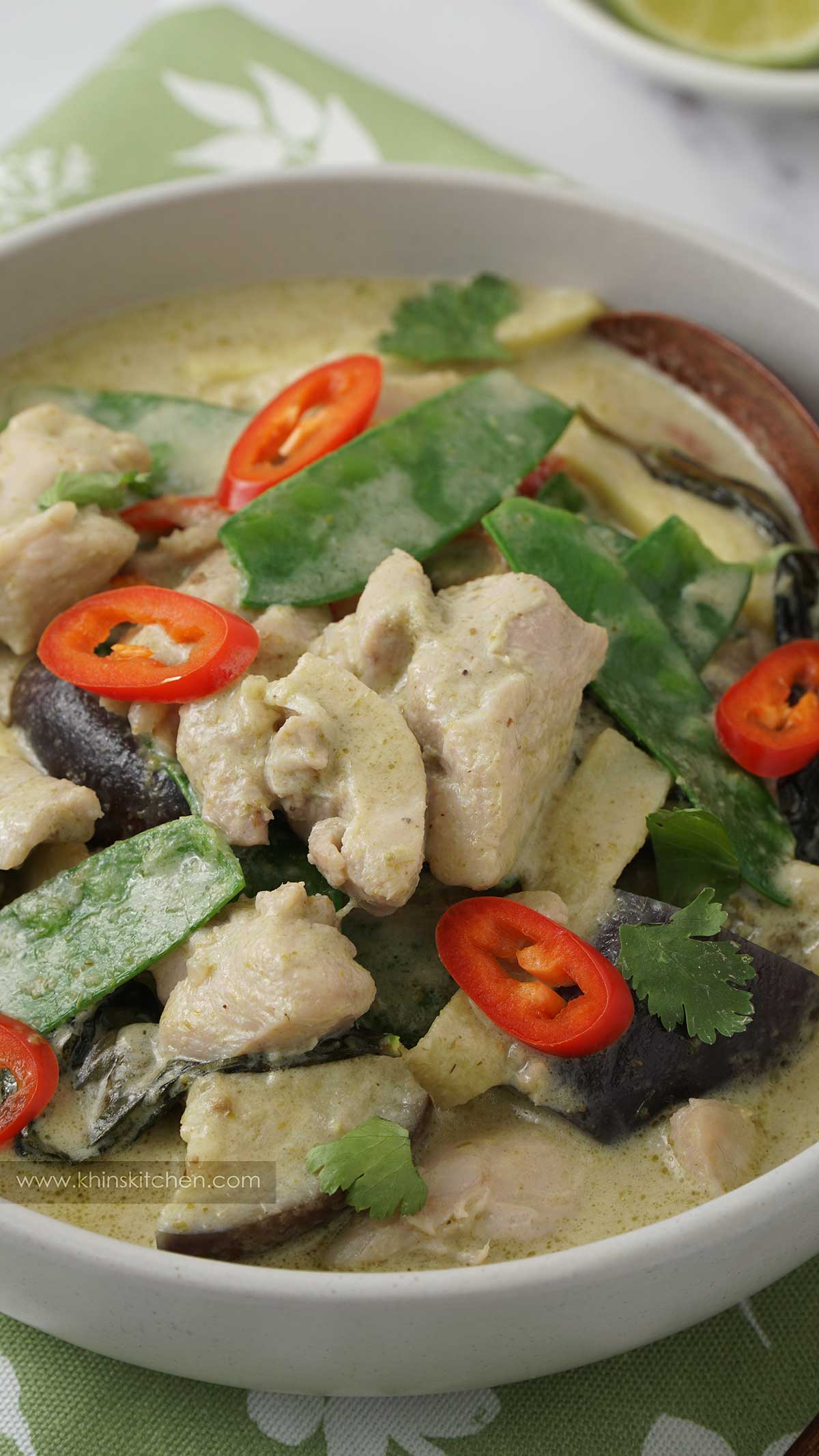 close up view of thai curry in a grey bowl.