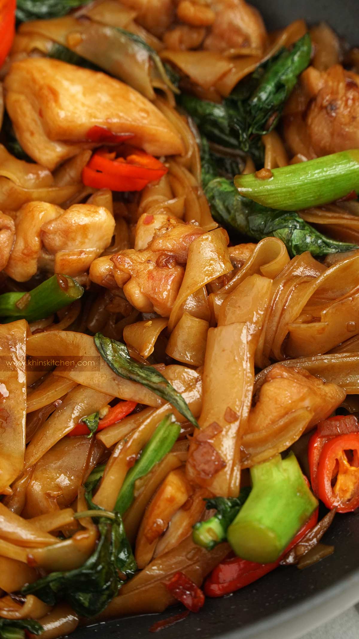 close up view of thai noodles stir fry in the pan.