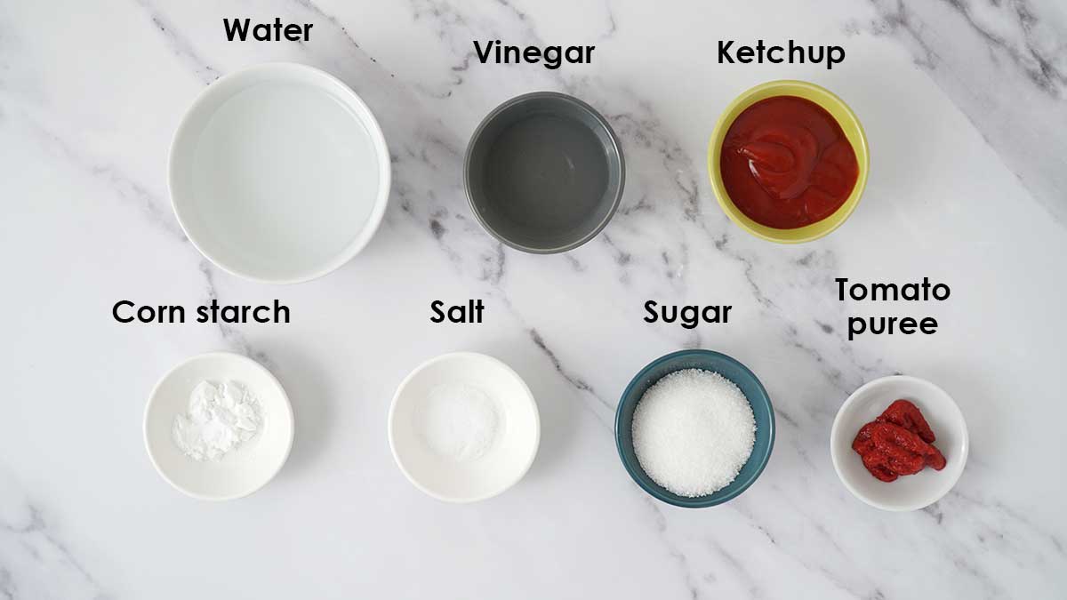 Ingredients for sweet and sour sauce on the white table.