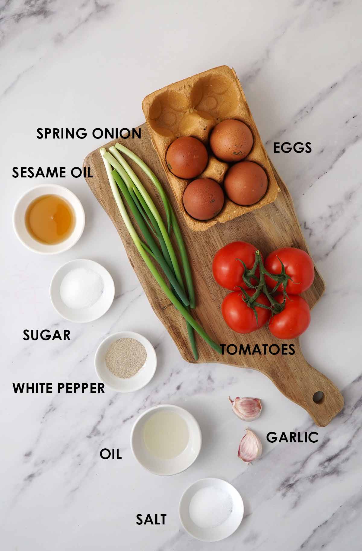 Labelled ingredients on a white table.