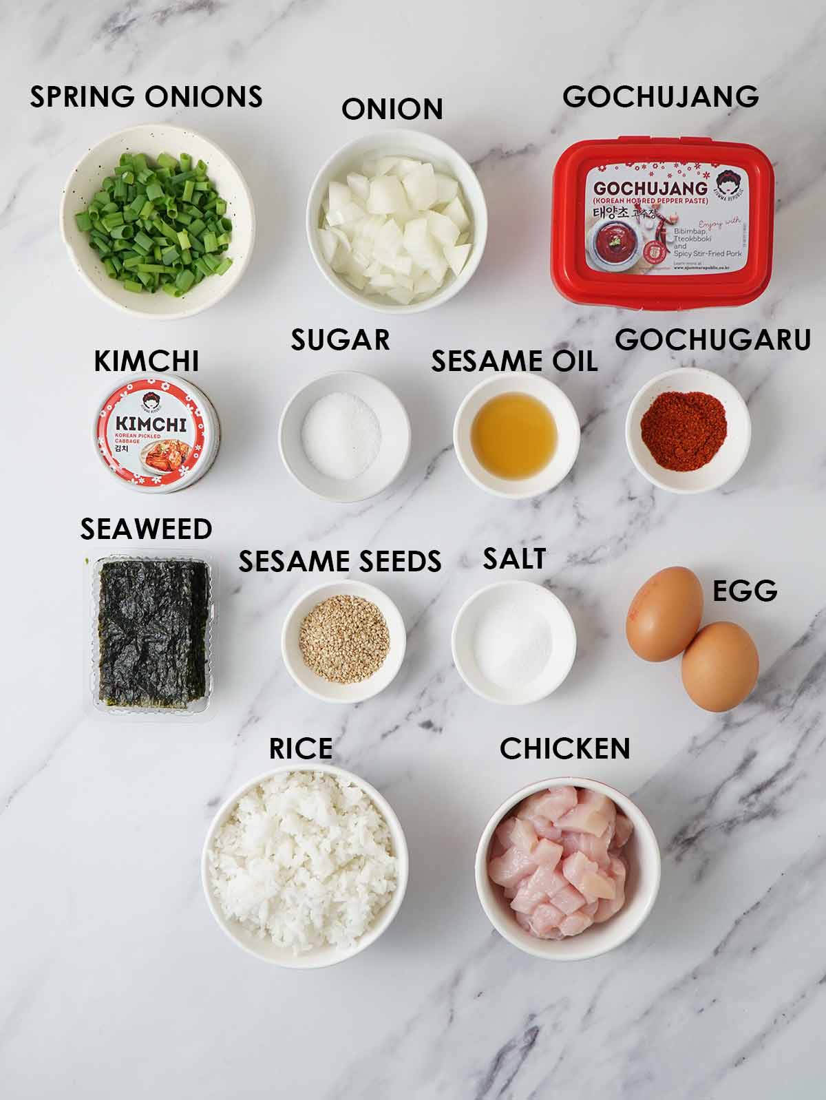 Labelled stir fry ingredients, garnish and toppings for kimchi fried rice. 