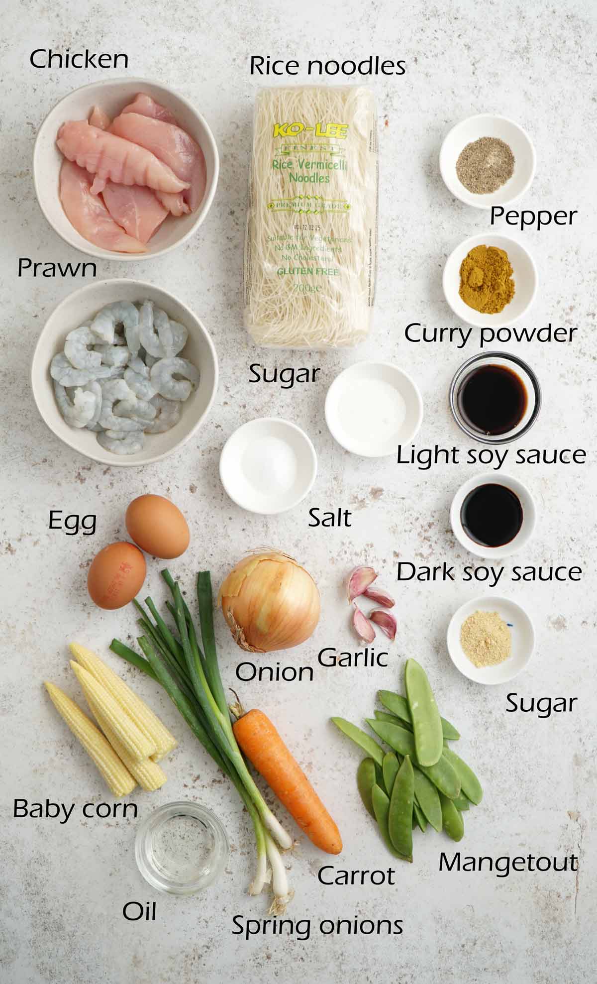 Labelled ingredients displayed on the white table.