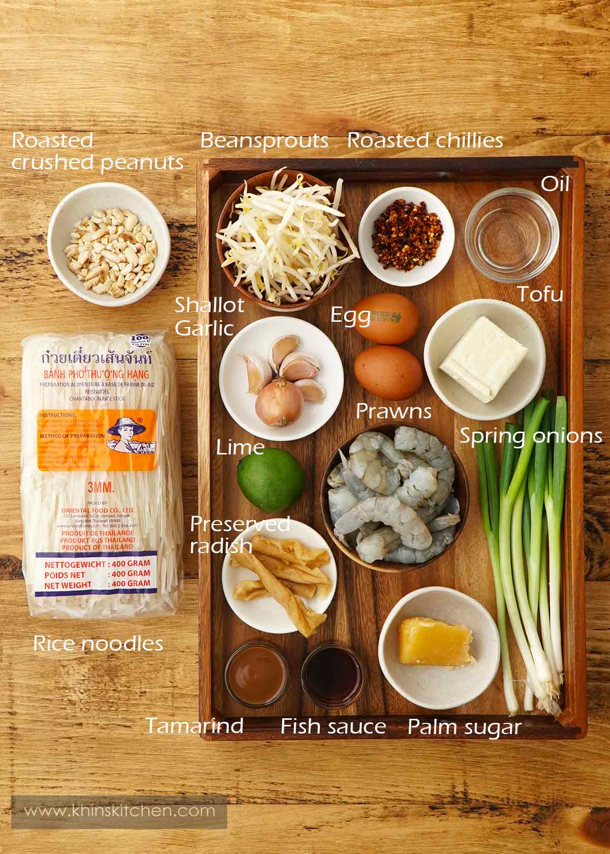 Labelled ingredients displayed on the brown table. 