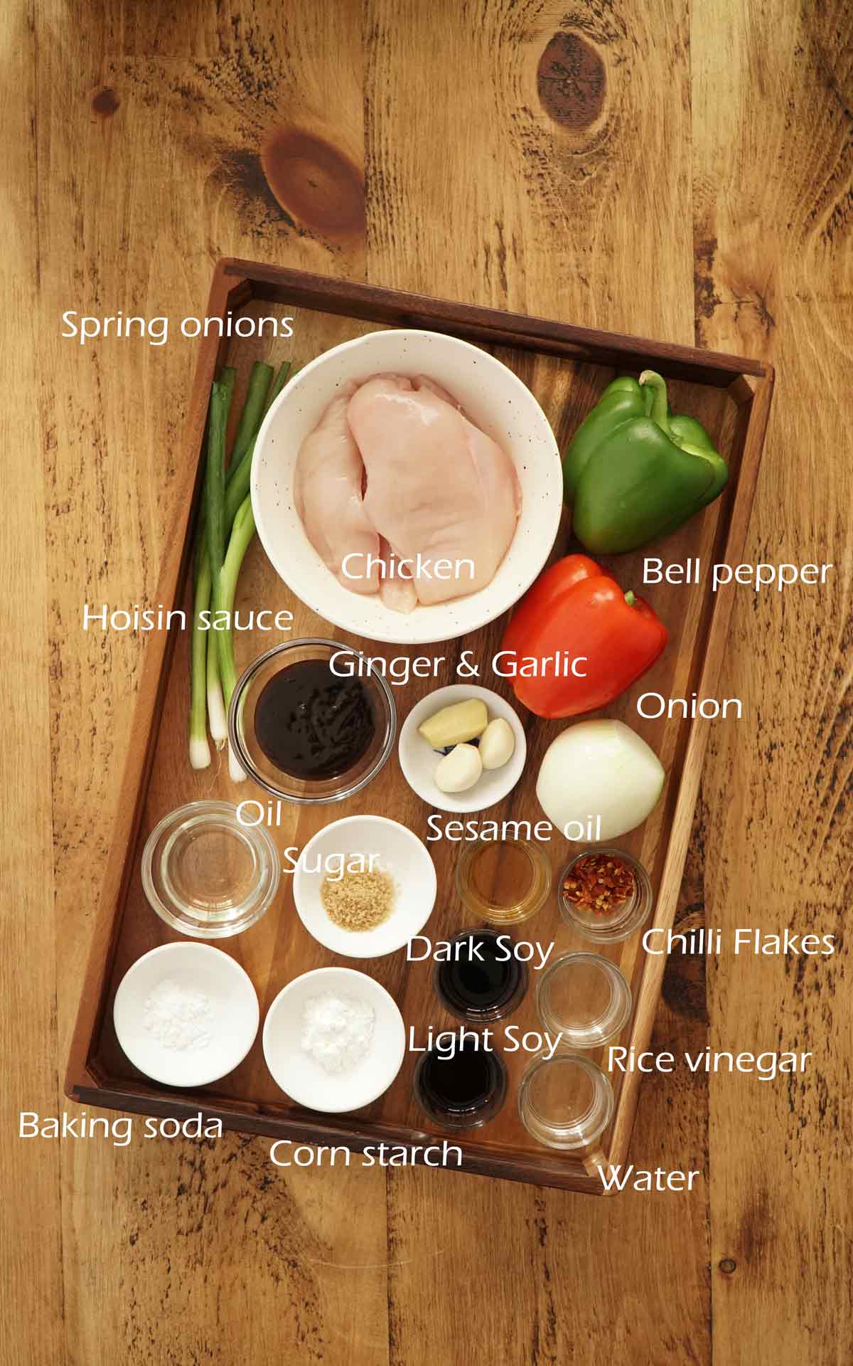 Labelled ingredients displayed on the wooden tray.