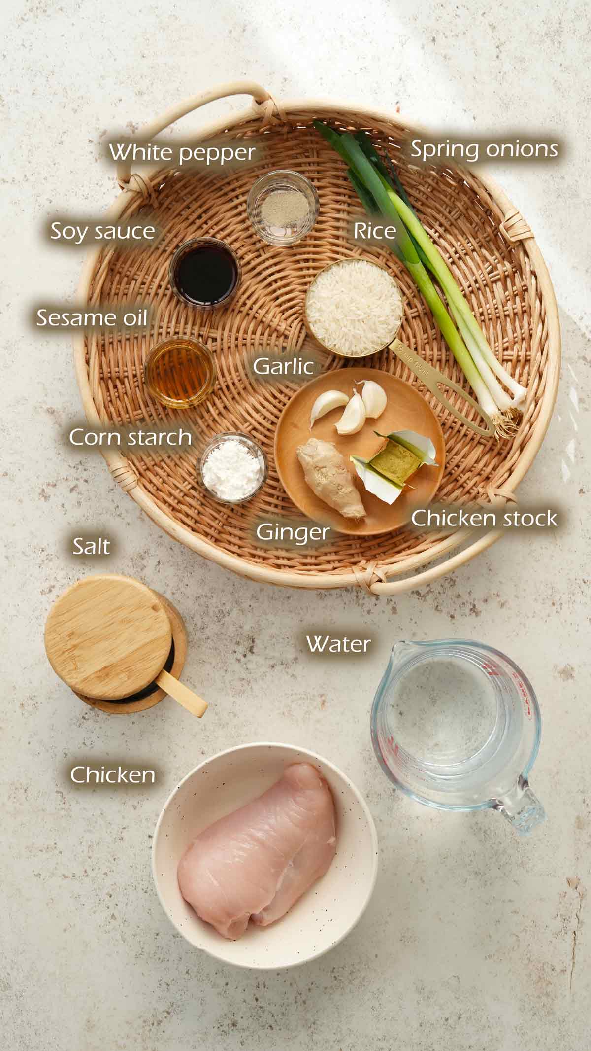 Labelled ingredients displayed on the white table. 
