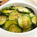 A photo of Japanese cucumber salad in a white bowl.