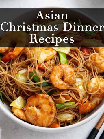 A photo of stir fry Asian rice noodles with shrimp and vegetables.