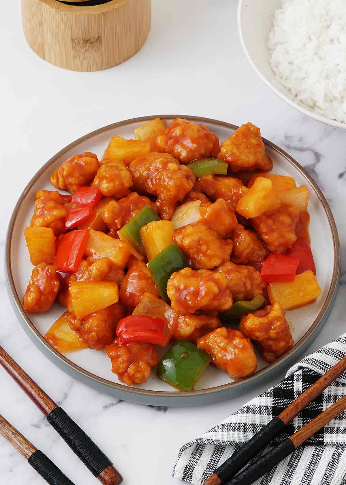 Chinese sweet and sour sauce with pineapples and bell peppers.